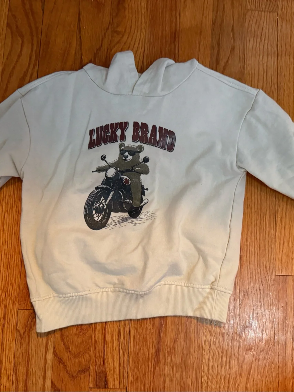 Lucky Brand Kids featuring a graphic print of a teddy bear riding a motorcycle.